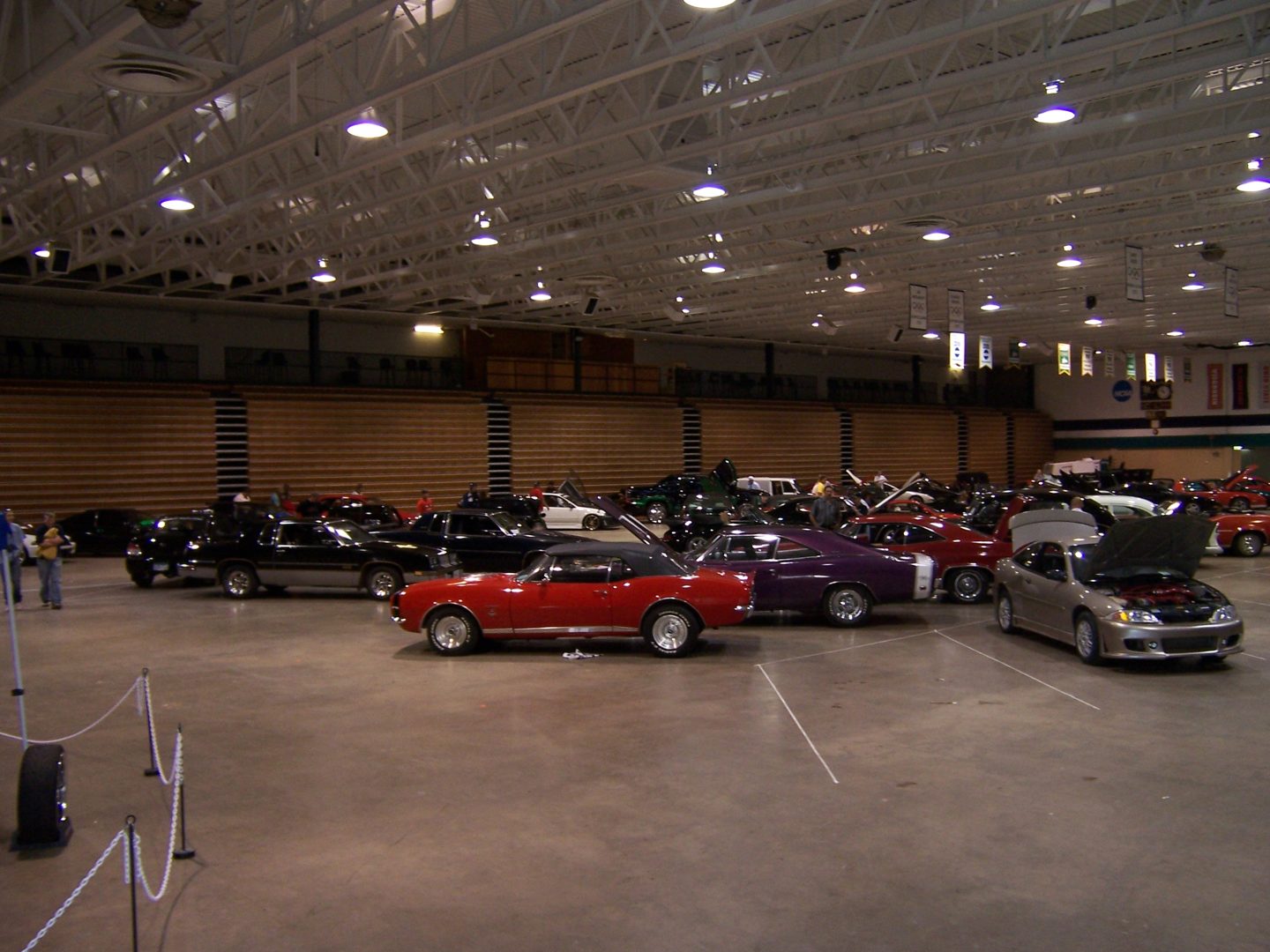 The 2008 Club Redline Street Show: rows of show cars with hoods up inside a northern Minnesota arena.